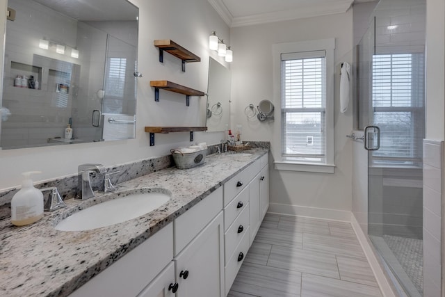4704B Michigan Ave, Nashville, TN 37209 - full bathroom featuring double vanity, plenty of natural light, a shower stall, and crown molding