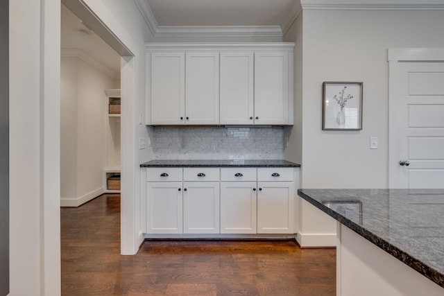 4704B Michigan Ave, Nashville, TN 37209 - kitchen with crown molding, dark wood-style floors, dark stone countertops, and white cabinetry