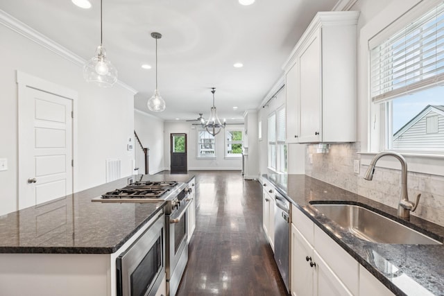 4704B Michigan Ave, Nashville, TN 37209 - kitchen featuring recessed lighting, appliances with stainless steel finishes, white cabinetry, dark wood-style flooring, and crown molding