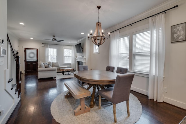 4704B Michigan Ave, Nashville, TN 37209 - dining room with crown molding, stairway, a fireplace, dark wood-type flooring, and a chandelier