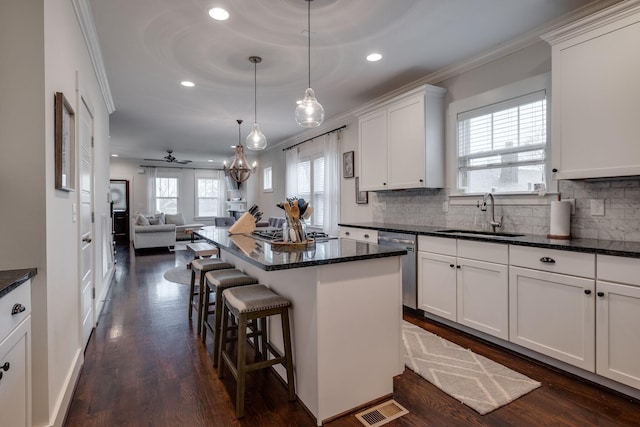 4704B Michigan Ave, Nashville, TN 37209 - kitchen featuring appliances with stainless steel finishes, crown molding, open floor plan, recessed lighting, and decorative backsplash