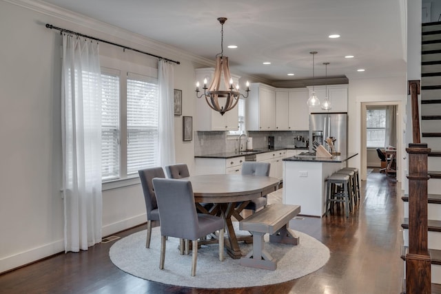 4704B Michigan Ave, Nashville, TN 37209 - dining space featuring a chandelier, dark wood-style flooring, ornamental molding, and recessed lighting