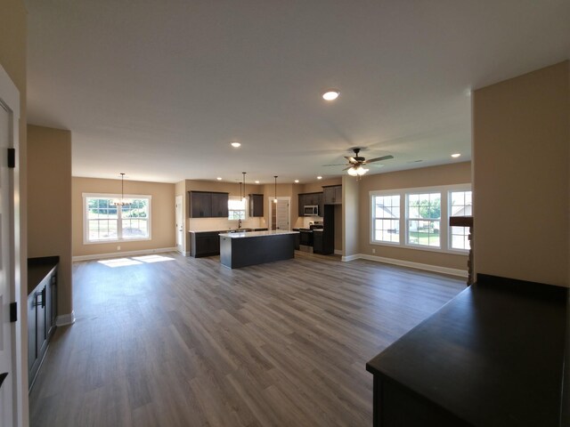 286 Turkey Crossing Ct, Clarksville, TN 37043 - unfurnished living room featuring ceiling fan, recessed lighting, a chandelier, plenty of natural light, and dark wood finished floors