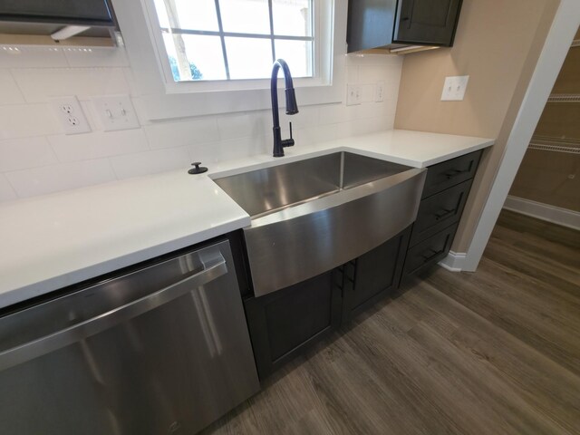 286 Turkey Crossing Ct, Clarksville, TN 37043 - kitchen with stainless steel dishwasher, dark wood-type flooring, decorative backsplash, and light countertops
