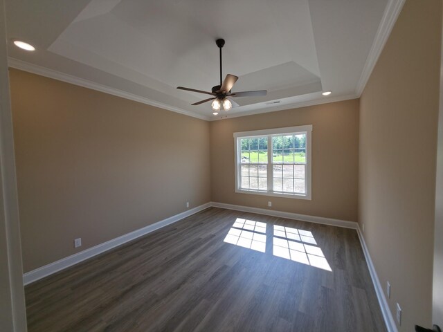 286 Turkey Crossing Ct, Clarksville, TN 37043 - spare room featuring a raised ceiling, dark wood finished floors, recessed lighting, a ceiling fan, and ornamental molding