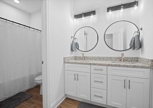 9407 Hackberry Ln, Soddy Daisy, TN 37379 - full bath featuring wood finished floors, double vanity, and shower / bath combo
