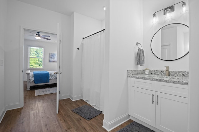 9407 Hackberry Ln, Soddy Daisy, TN 37379 - bathroom with connected bathroom, vanity, wood finished floors, a ceiling fan, and curtained shower