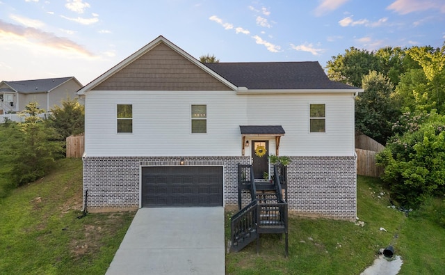 9407 Hackberry Ln, Soddy Daisy, TN 37379 - view of front of house with brick siding, an attached garage, and driveway