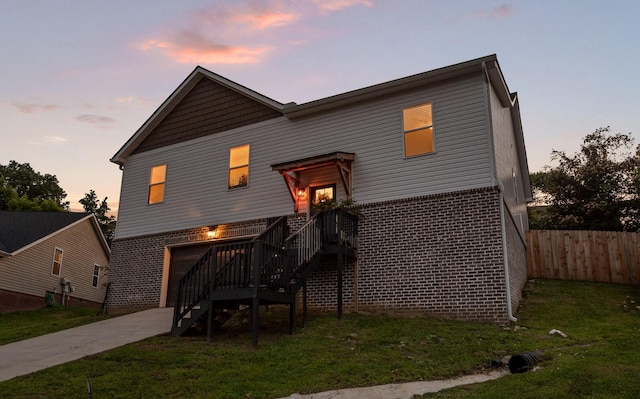 9407 Hackberry Ln, Soddy Daisy, TN 37379 - view of front of house featuring concrete driveway, brick siding, a garage, and stairway