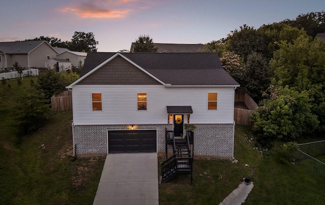 9407 Hackberry Ln, Soddy Daisy, TN 37379 - view of front facade with driveway, an attached garage, and brick siding