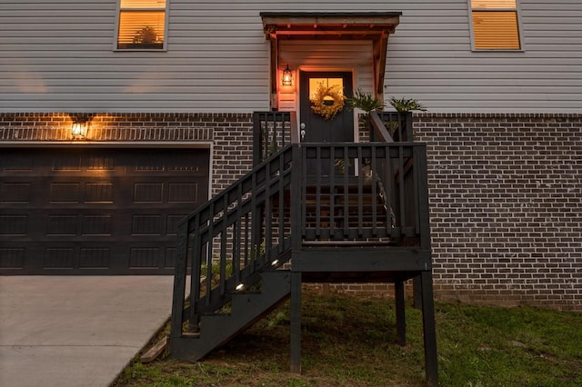 9407 Hackberry Ln, Soddy Daisy, TN 37379 - doorway to property with brick siding, a garage, and driveway