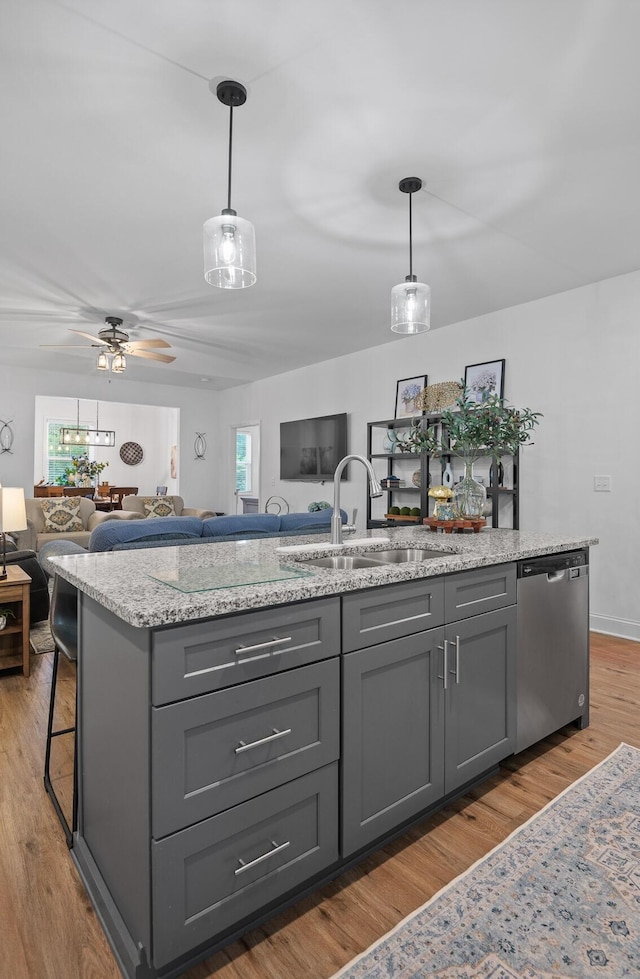 9407 Hackberry Ln, Soddy Daisy, TN 37379 - kitchen with dishwasher, gray cabinetry, open floor plan, and light wood-style flooring