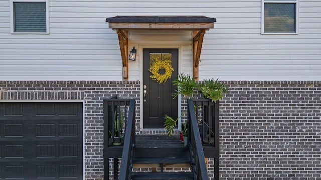 9407 Hackberry Ln, Soddy Daisy, TN 37379 - property entrance with a garage and brick siding