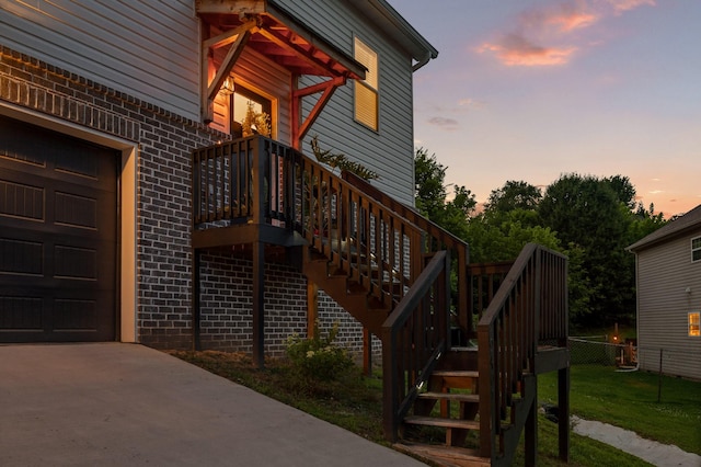 9407 Hackberry Ln, Soddy Daisy, TN 37379 - exterior entry at dusk with brick siding and concrete driveway