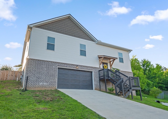 9407 Hackberry Ln, Soddy Daisy, TN 37379 - view of front of home featuring brick siding, an attached garage, and concrete driveway