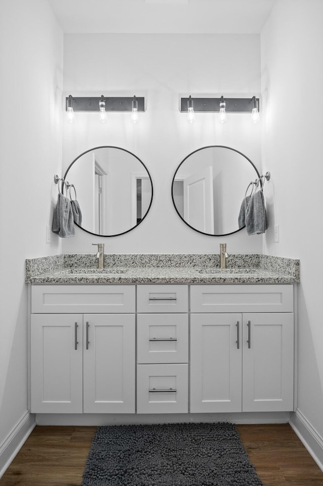 9407 Hackberry Ln, Soddy Daisy, TN 37379 - bathroom with double vanity and wood finished floors