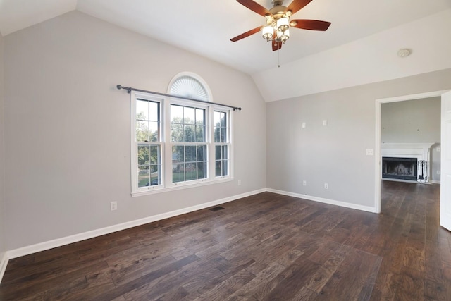 117 Fitzpatrick Ct, Nashville, TN 37214 - unfurnished room with lofted ceiling, a ceiling fan, dark wood-style floors, and a fireplace