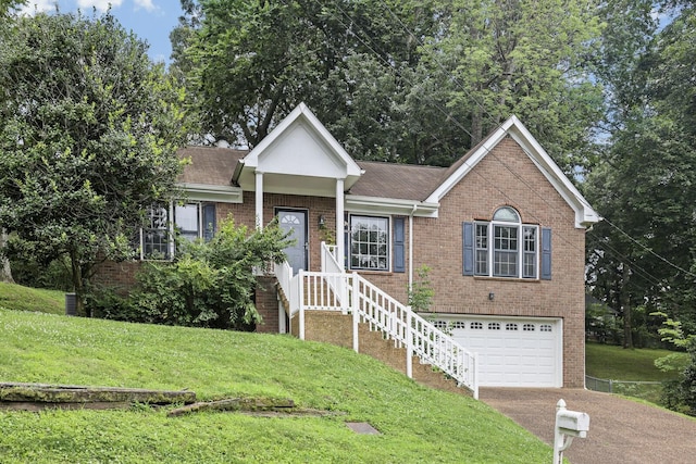 117 Fitzpatrick Ct, Nashville, TN 37214 - ranch-style house featuring brick siding, a front lawn, driveway, an attached garage, and a shingled roof