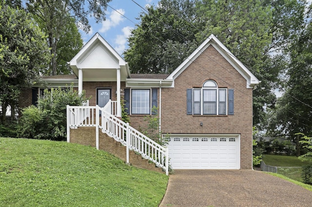 117 Fitzpatrick Ct, Nashville, TN 37214 - view of front of home featuring brick siding, concrete driveway, and a front yard