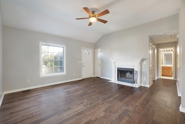 117 Fitzpatrick Ct, Nashville, TN 37214 - unfurnished living room featuring attic access, ceiling fan, dark wood-style flooring, vaulted ceiling, and a fireplace with flush hearth