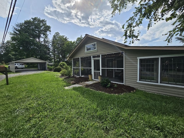 9311 Scenic Hwy, Lookout Mountain, GA 30750 - rear view of property with a lawn, a carport, and a sunroom