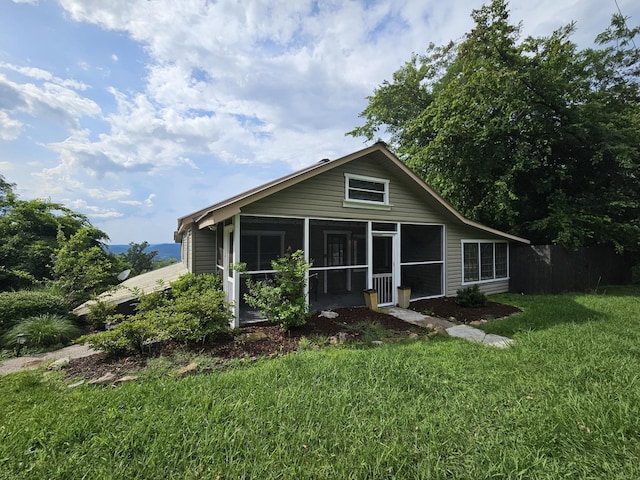 9311 Scenic Hwy, Lookout Mountain, GA 30750 - view of front facade featuring a sunroom and a front yard
