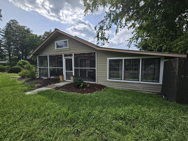 9311 Scenic Hwy, Lookout Mountain, GA 30750 - back of property featuring a sunroom and a lawn