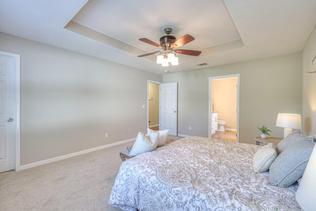 5451 Middlebury Dr, Murfreesboro, TN 37128 - bedroom with a raised ceiling, light colored carpet, ensuite bathroom, and a ceiling fan