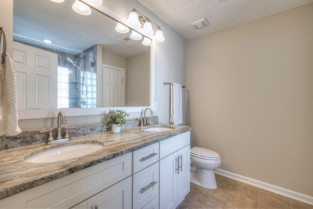 5451 Middlebury Dr, Murfreesboro, TN 37128 - bathroom with double vanity, a tile shower, and tile patterned flooring
