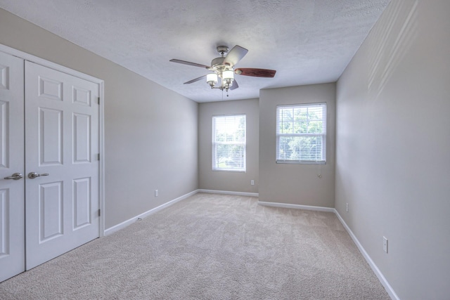 5451 Middlebury Dr, Murfreesboro, TN 37128 - spare room featuring light carpet, ceiling fan, and a textured ceiling
