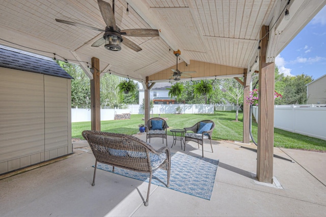 5451 Middlebury Dr, Murfreesboro, TN 37128 - fenced backyard with a patio, ceiling fan, and an outdoor hangout area
