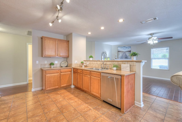 5451 Middlebury Dr, Murfreesboro, TN 37128 - kitchen featuring stainless steel dishwasher, a peninsula, light countertops, recessed lighting, and a textured ceiling