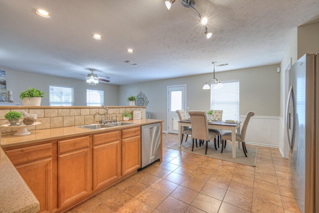 5451 Middlebury Dr, Murfreesboro, TN 37128 - kitchen featuring appliances with stainless steel finishes, plenty of natural light, recessed lighting, a wainscoted wall, and ceiling fan
