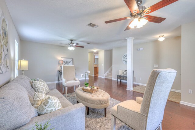 5451 Middlebury Dr, Murfreesboro, TN 37128 - living area featuring ceiling fan, stairs, wood finished floors, and decorative columns