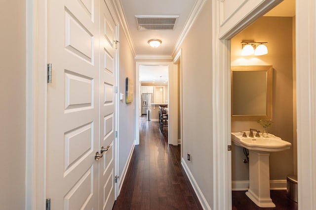 7040 Wenlock Ln, Franklin, TN 37064 - hallway with dark wood finished floors and crown molding