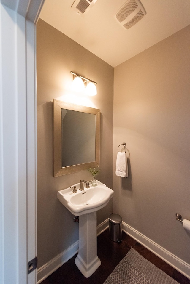 7040 Wenlock Ln, Franklin, TN 37064 - half bathroom featuring baseboards and wood finished floors