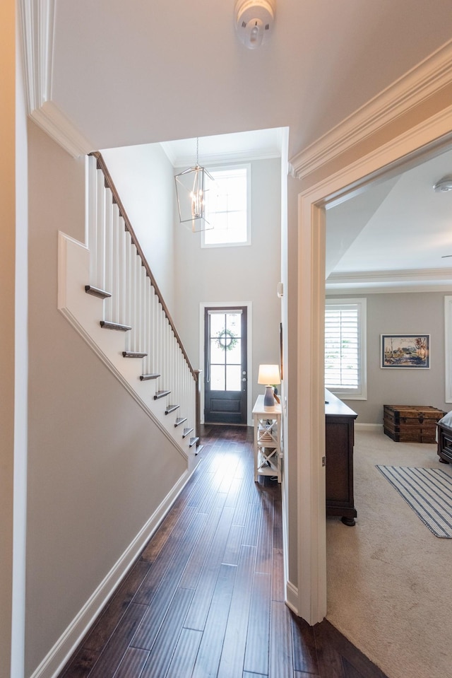 7040 Wenlock Ln, Franklin, TN 37064 - foyer featuring a chandelier, crown molding, stairway, and dark wood-type flooring