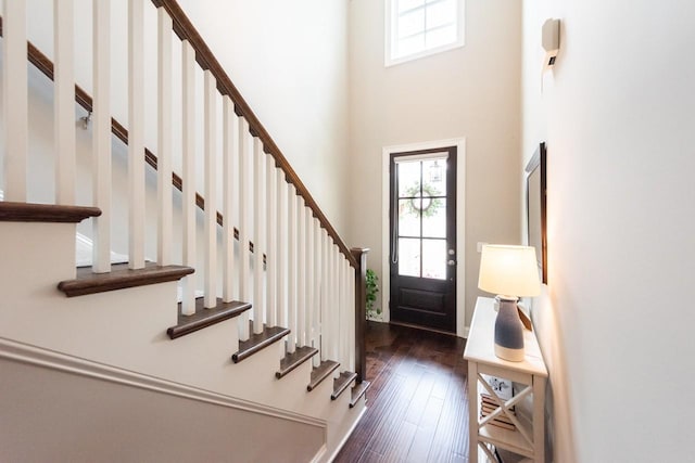 7040 Wenlock Ln, Franklin, TN 37064 - foyer entrance with wood-type flooring, a towering ceiling, and stairway