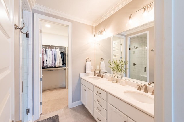 7040 Wenlock Ln, Franklin, TN 37064 - bathroom featuring double vanity, a shower stall, a walk in closet, and crown molding