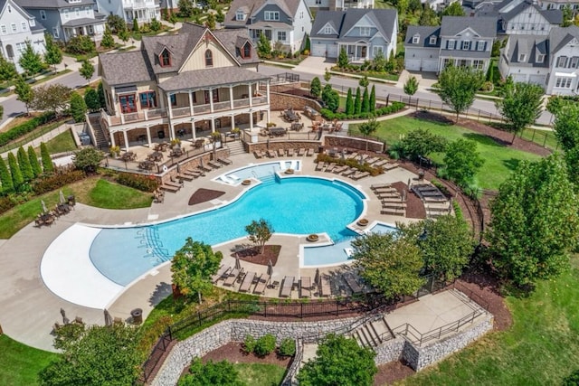 7040 Wenlock Ln, Franklin, TN 37064 - community pool with stairway, a patio, and a residential view