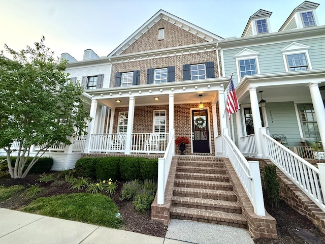7040 Wenlock Ln, Franklin, TN 37064 - colonial house featuring covered porch and brick siding