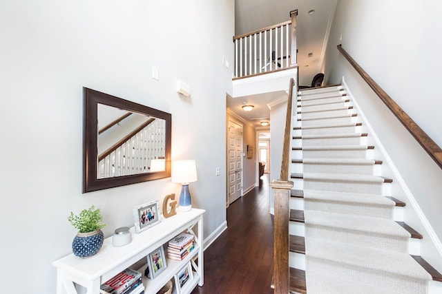 7040 Wenlock Ln, Franklin, TN 37064 - stairway with wood finished floors, a high ceiling, and crown molding