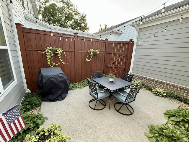 7040 Wenlock Ln, Franklin, TN 37064 - view of patio with outdoor dining space, area for grilling, and a gate
