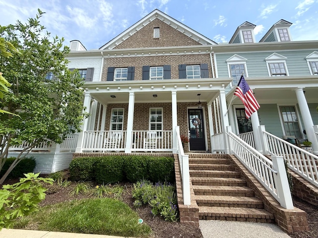 7040 Wenlock Ln, Franklin, TN 37064 - colonial-style house with covered porch and brick siding