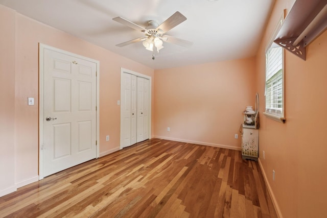 32 Morris Ln, Pleasant Shade, TN 37145 - unfurnished bedroom with wood finished floors, a ceiling fan, and a closet