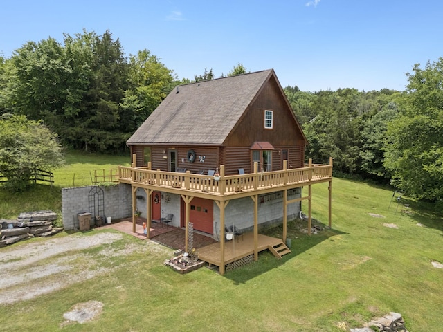 32 Morris Ln, Pleasant Shade, TN 37145 - back of property with a deck, a lawn, log exterior, and roof with shingles