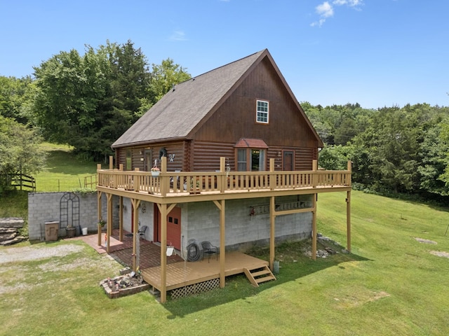 32 Morris Ln, Pleasant Shade, TN 37145 - back of house featuring a wooden deck, log exterior, a yard, and a wooded view