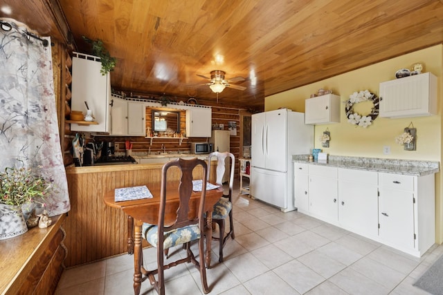 32 Morris Ln, Pleasant Shade, TN 37145 - kitchen with freestanding refrigerator, wooden ceiling, light tile patterned floors, ceiling fan, and light countertops