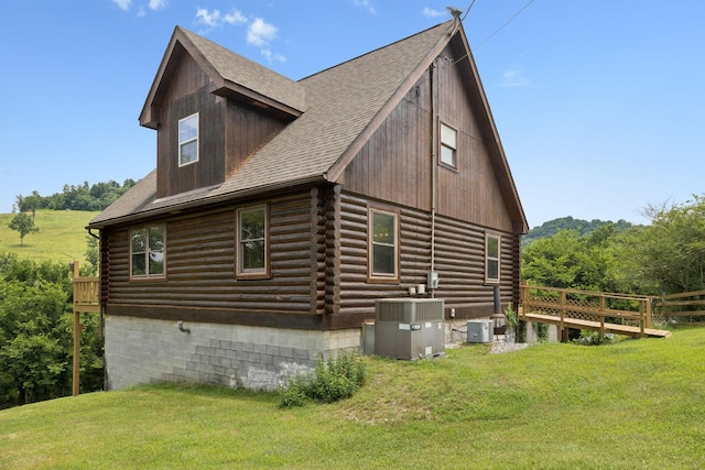 32 Morris Ln, Pleasant Shade, TN 37145 - view of home's exterior featuring log exterior, a yard, and roof with shingles