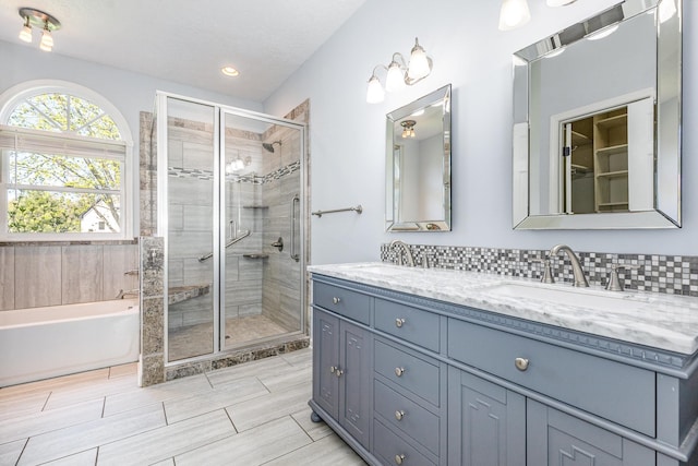 1622 Hickory Valley Rd, Lebanon, TN 37087 - bathroom featuring double vanity, a bath, a shower stall, and recessed lighting